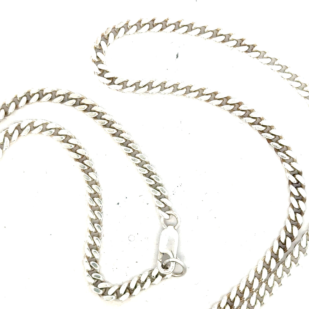 Silver curb chain weighing 24.8g, featuring a classic design and sturdy links, ideal for jewelry making or layered accessories.