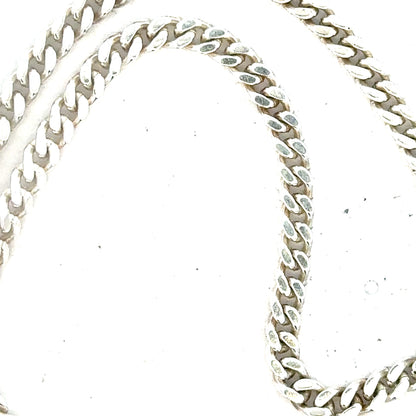 Silver curb chain weighing 24.8 grams, featuring a classic linked design, made by an unbranded manufacturer.