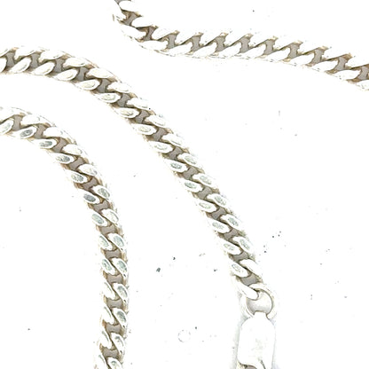 Silver curb chain weighing 24.8g with a classic design, displayed on a neutral background.