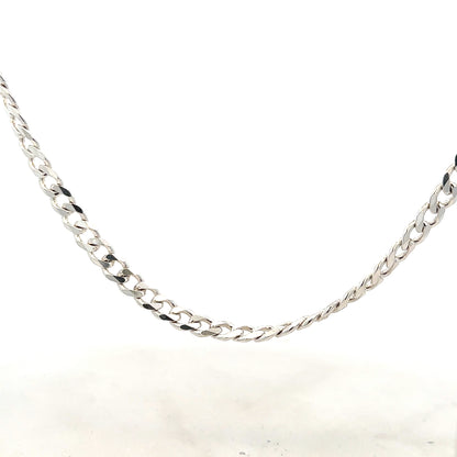 Silver curb chain weighing 27.8g, displayed on a plain background, showcasing its links and polished finish.