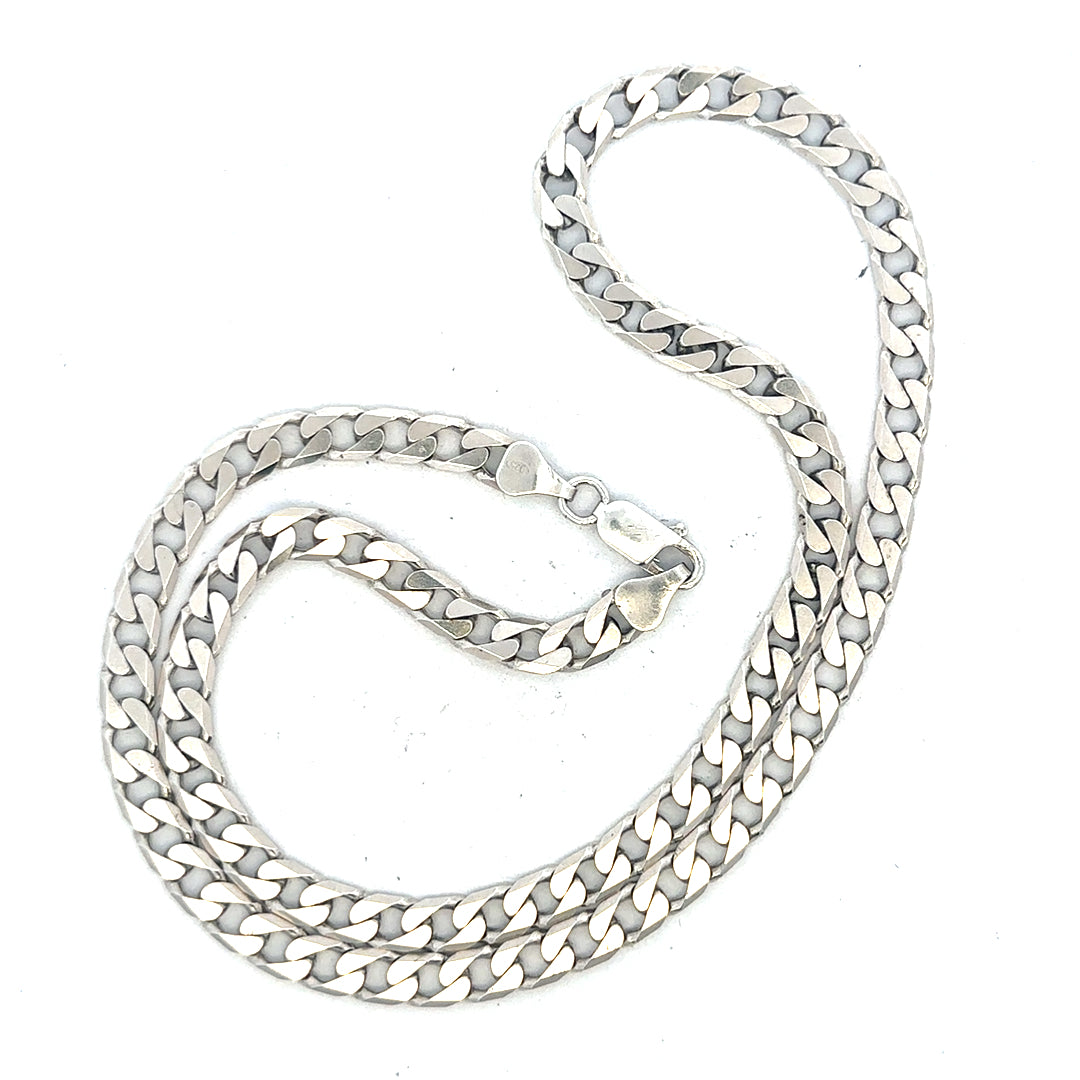 Silver curb chain weighing 31.3g, showcasing a detailed, polished unbranded jewelry chain with classic curb link design.