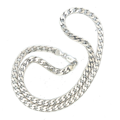 Silver curb chain weighing 31.3g, showcasing a detailed, polished unbranded jewelry chain with classic curb link design.