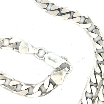 Silver curb chain weighing 31.3g, showcasing polished links, unbranded jewelry accessory, detailed close-up image.