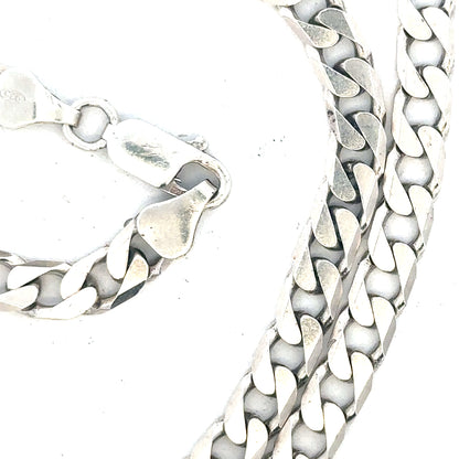 Silver curb chain weighing 31.3g with interconnected oval links, unbranded jewelry accessory on a neutral background.