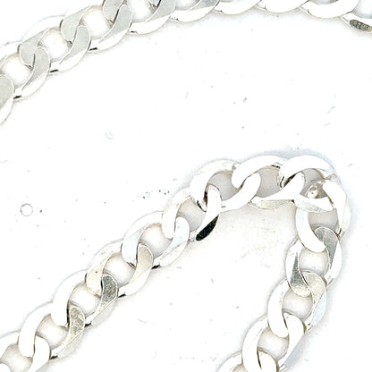 Silver curb chain weighing 34.5g with a classic design, featuring interconnected flat links, ideal for jewelry or accessories.