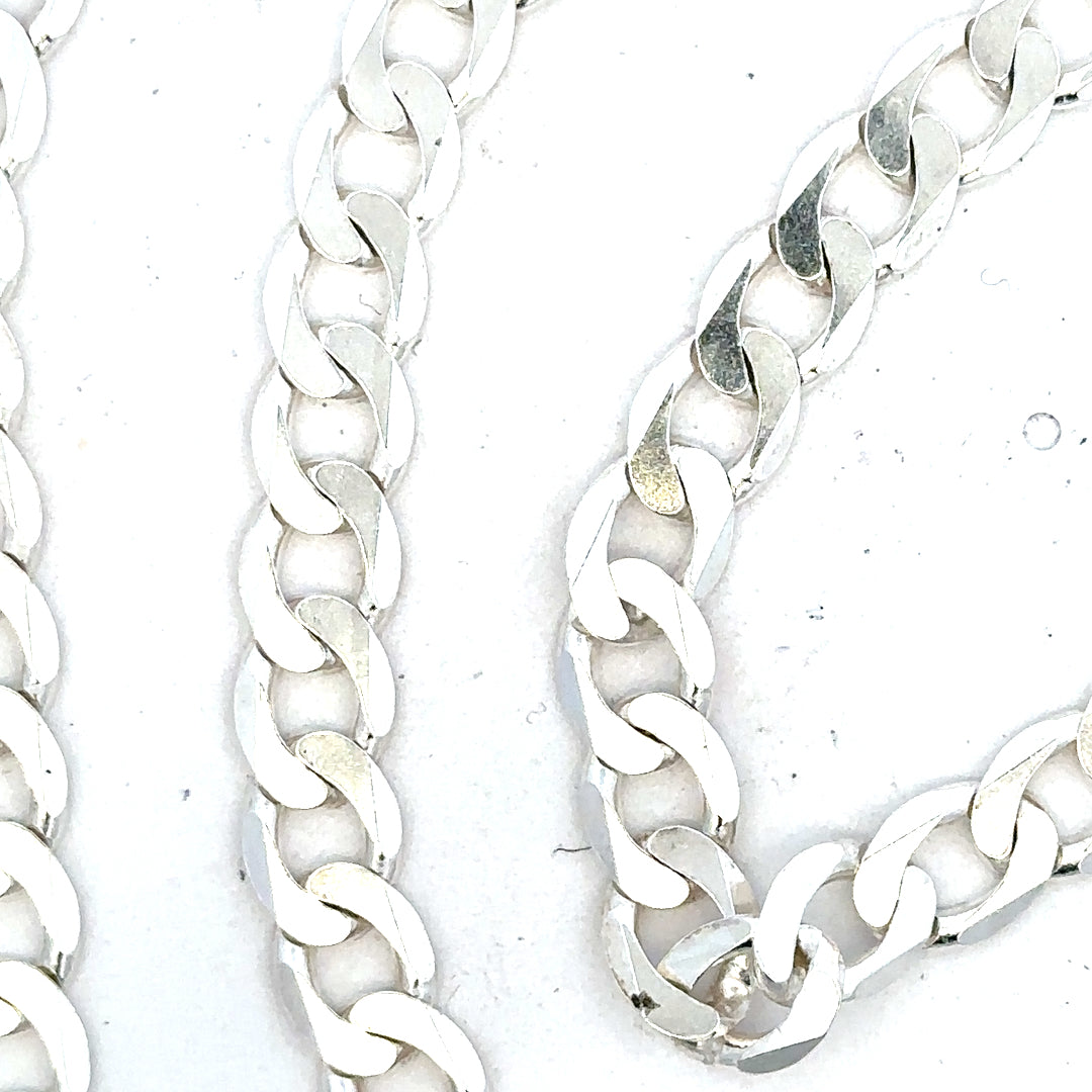 Silver curb chain weighing 34.5g with a polished finish, displayed on a plain background.