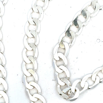 Silver curb chain weighing 34.5g with a polished finish, displayed on a plain background.