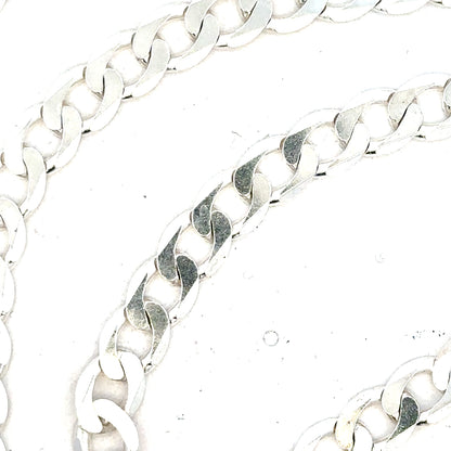 Silver curb chain weighing 34.5g with a sleek design, displayed on a plain background, perfect for jewelry styling.