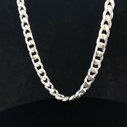 Silver curb chain weighing 48.8g, featuring interlocking links, crafted for a stylish and versatile jewelry accessory.