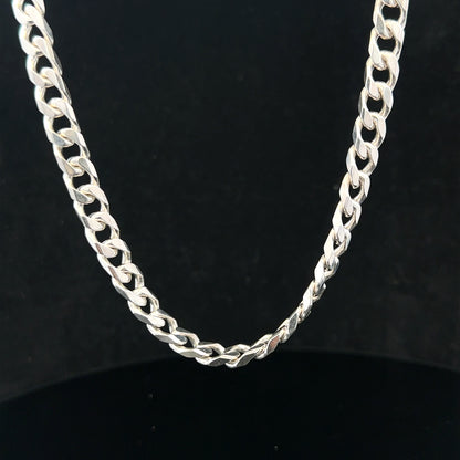 Silver curb chain weighing 48.8g with a sleek design, displayed against a neutral background.