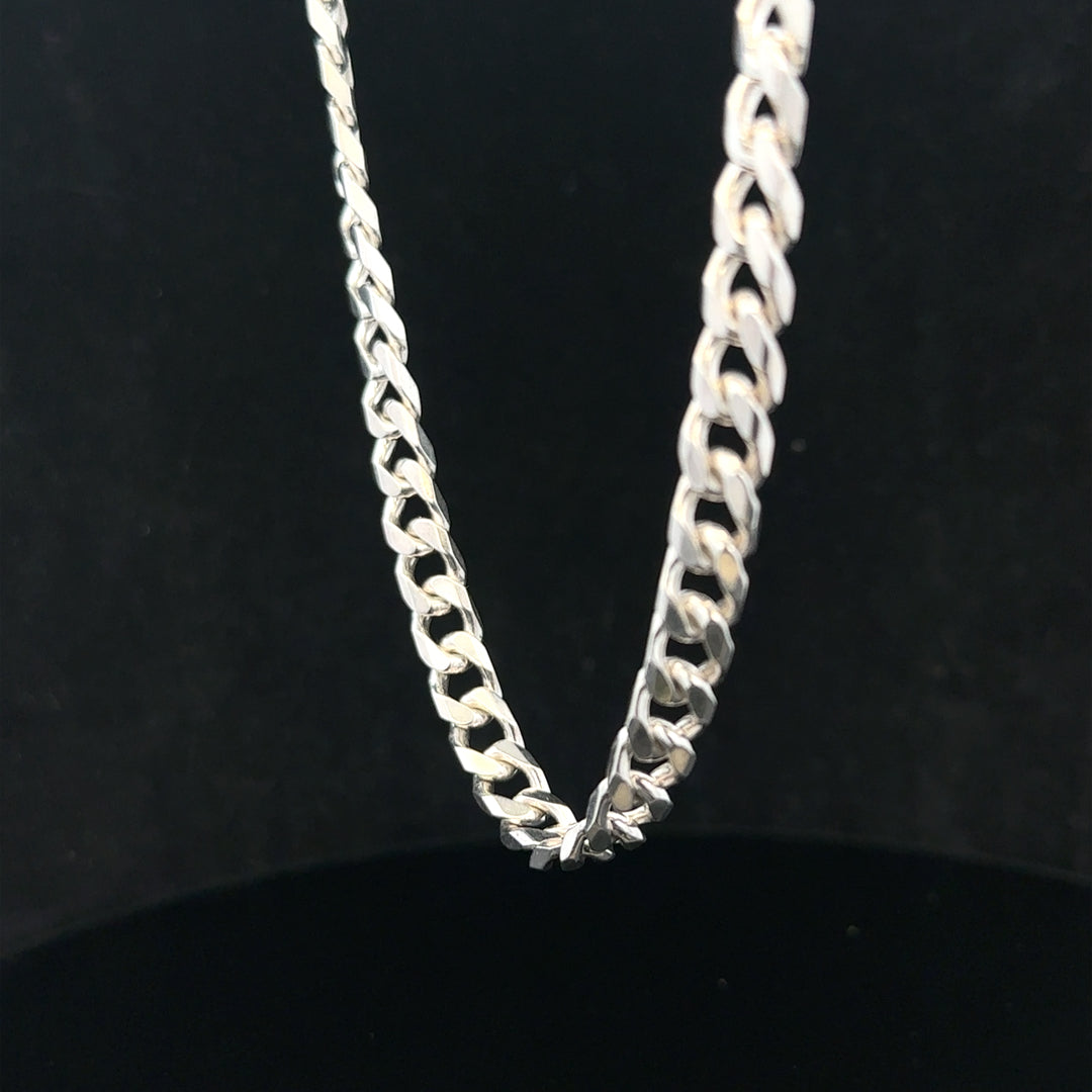 Silver curb chain weighing 48.8g, featuring a classic linked design, perfect for jewelry making or as a stylish accessory.