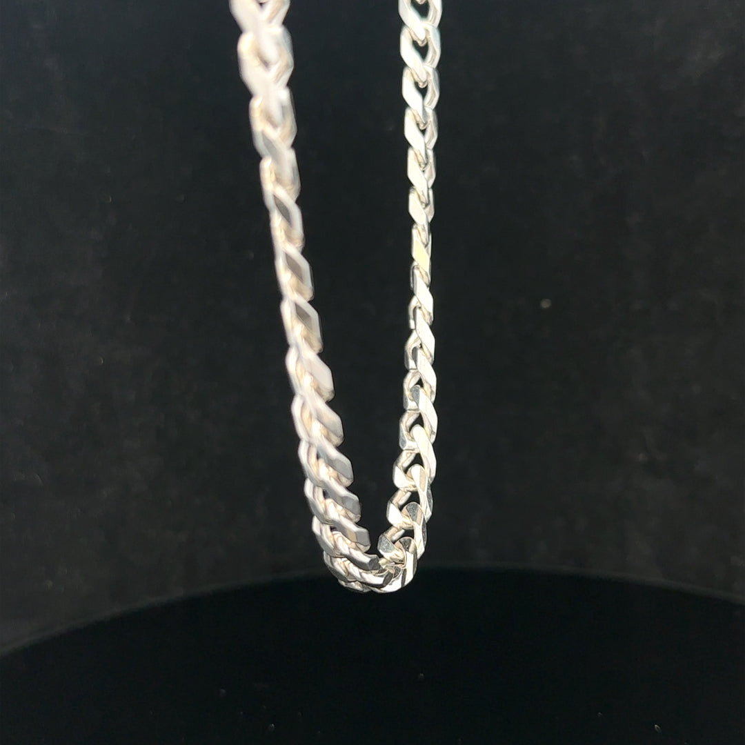 Silver curb chain weighing 48.8g, featuring linked oval-shaped metal links, crafted for stylish jewelry accessories.