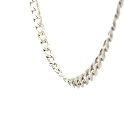 Silver curb chain weighing 59.3g, featuring a classic design with interlocking links, suitable for jewelry or accessories.