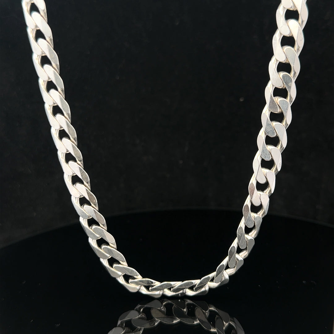 Silver curb chain weighing 60.4g, featuring classic interlinked design, suitable for jewelry or accessories.