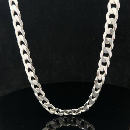 Silver curb chain weighing 60.4g, featuring classic interlinked design, suitable for jewelry or accessories.