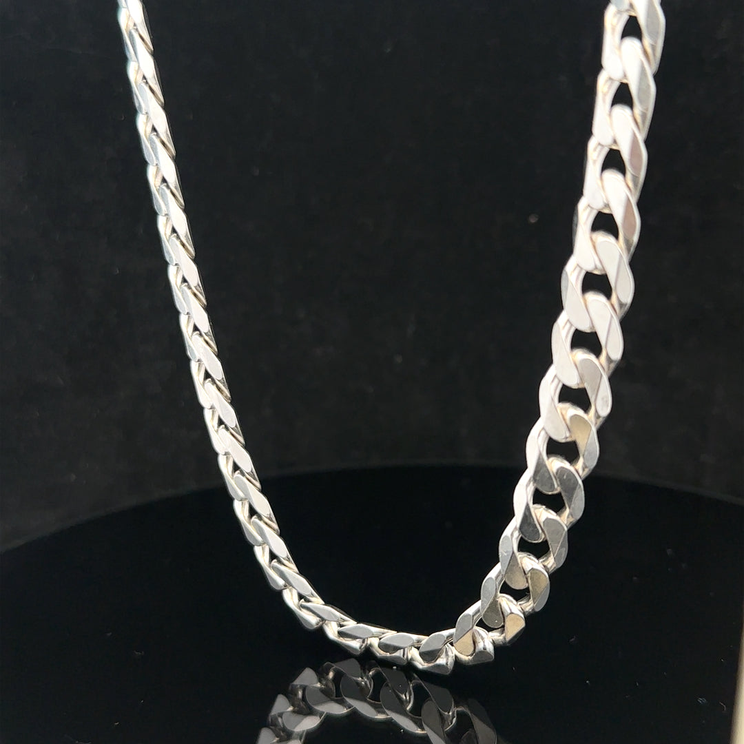 Silver curb chain weighing 60.4g, showcasing a sleek, polished jewelry chain with a classic curb link design.