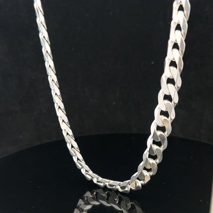 Silver curb chain weighing 60.4g, showcasing a sleek, polished jewelry chain with a classic curb link design.