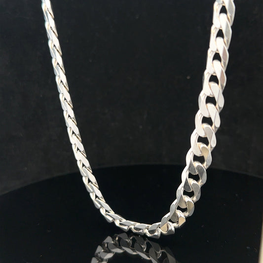 Silver curb chain weighing 60.4g, showcasing a sleek, polished jewelry chain with a classic curb link design.