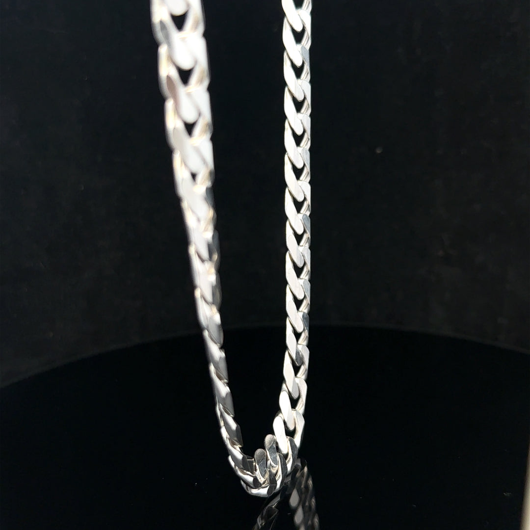 Silver curb chain weighing 60.4g, featuring classic linked design, displayed on a neutral background.