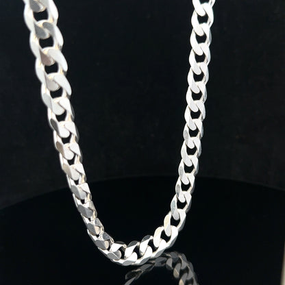 Silver curb chain weighing 60.4g with a sleek, polished design, showcasing a classic jewelry style and sturdy links.