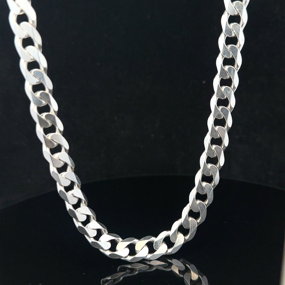Silver curb chain weighing 60.4g, featuring interconnected flat oval links, displayed on a neutral background.