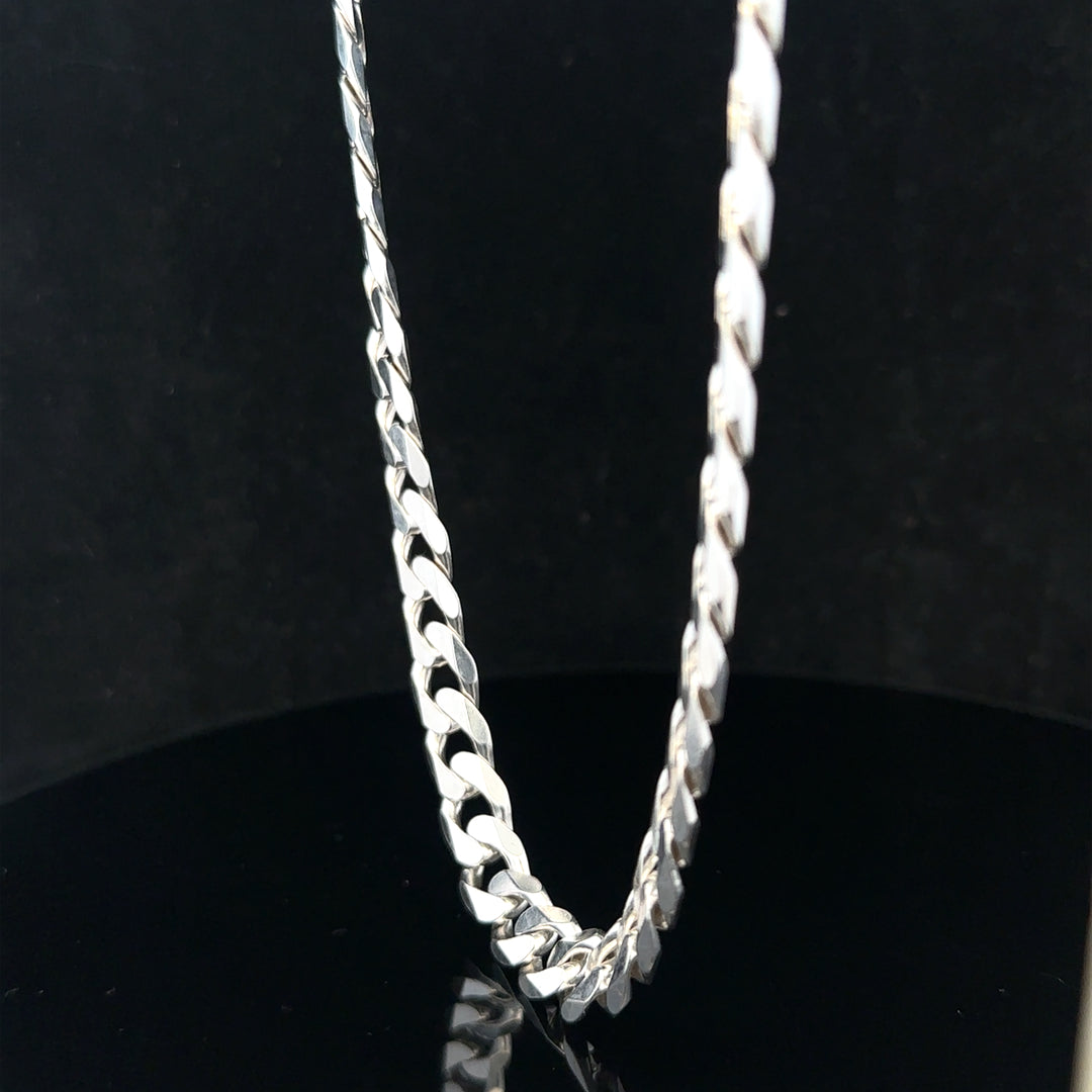 Silver curb chain weighing 60.4g, featuring a classic design, shown in a detailed close-up image.
