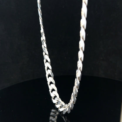 Silver curb chain weighing 60.4g, featuring a classic design, shown in a detailed close-up image.