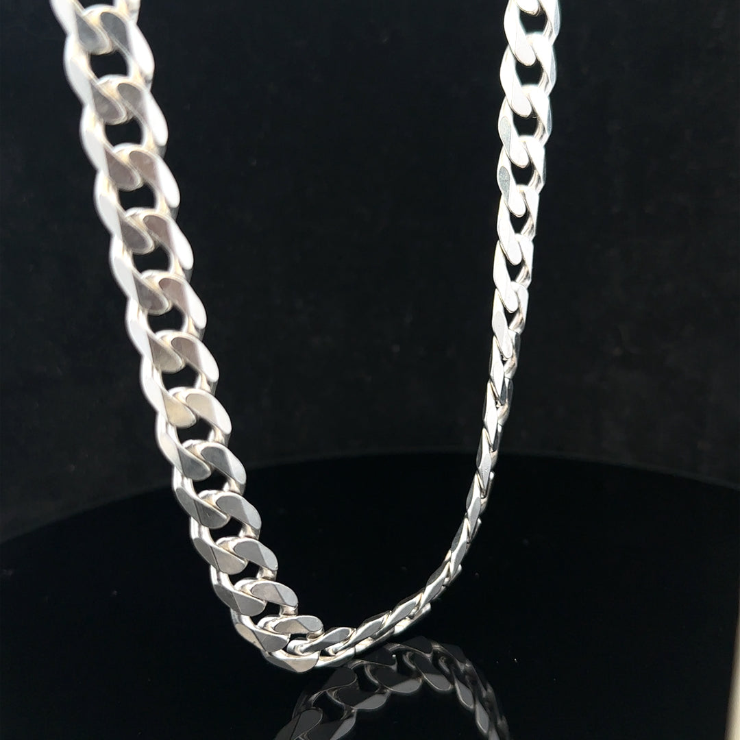 Silver curb chain weighing 60.4g, unbranded jewelry piece featuring interlocking links with a sleek, polished finish.