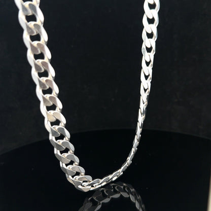 Silver curb chain weighing 60.4g, unbranded jewelry piece featuring interlocking links with a sleek, polished finish.