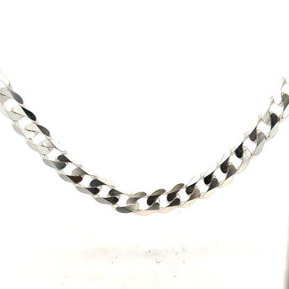 Silver curb chain weighing 60.8g, featuring a classic linked design, shown laid flat with a shiny finish.