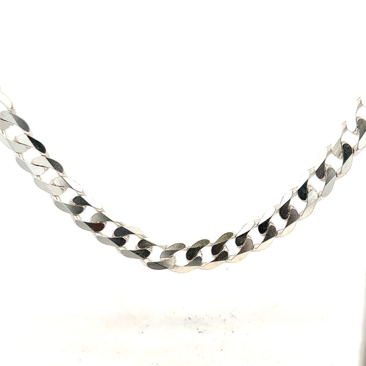 Silver curb chain weighing 60.8g, featuring a classic linked design, shown laid flat with a shiny finish.