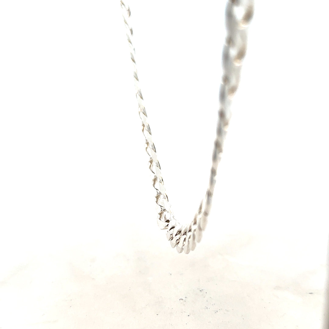 Silver curb chain weighing 60.8g, featuring interlinked flat oval links, perfect for jewelry making or as a stylish accessory.