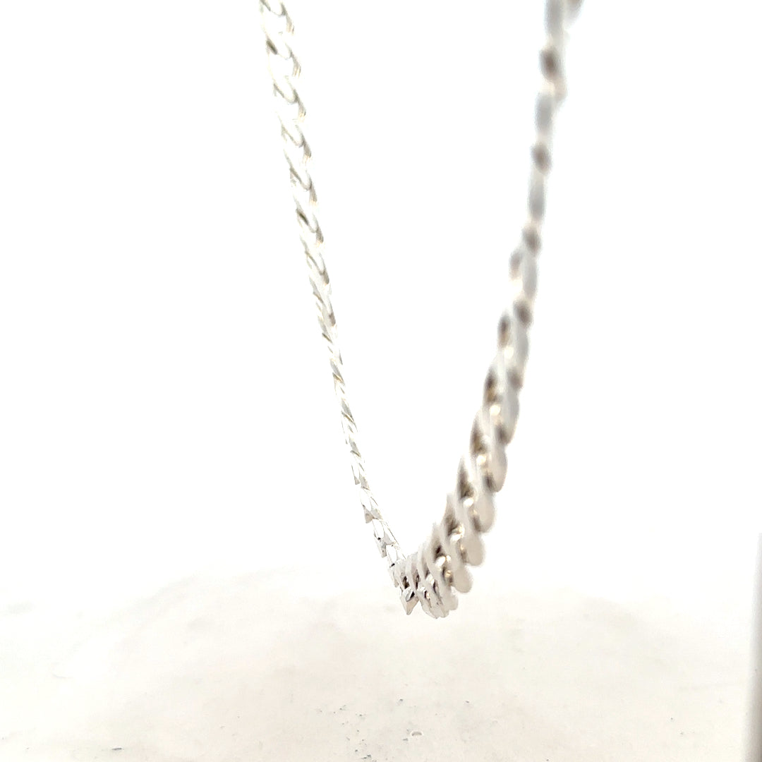 Silver curb chain weighing 60.8g, featuring a classic design, photographed on a neutral background highlighting its polished links.