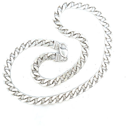 Silver curb chain weighing 63.4g, featuring a classic design and polished finish, displayed against a neutral background.