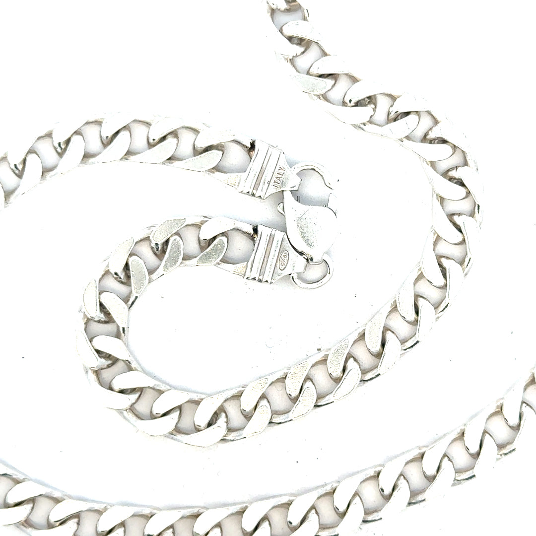 Silver curb chain weighing 63.4g, featuring sturdy links and a polished finish, ideal for jewelry or accessories.