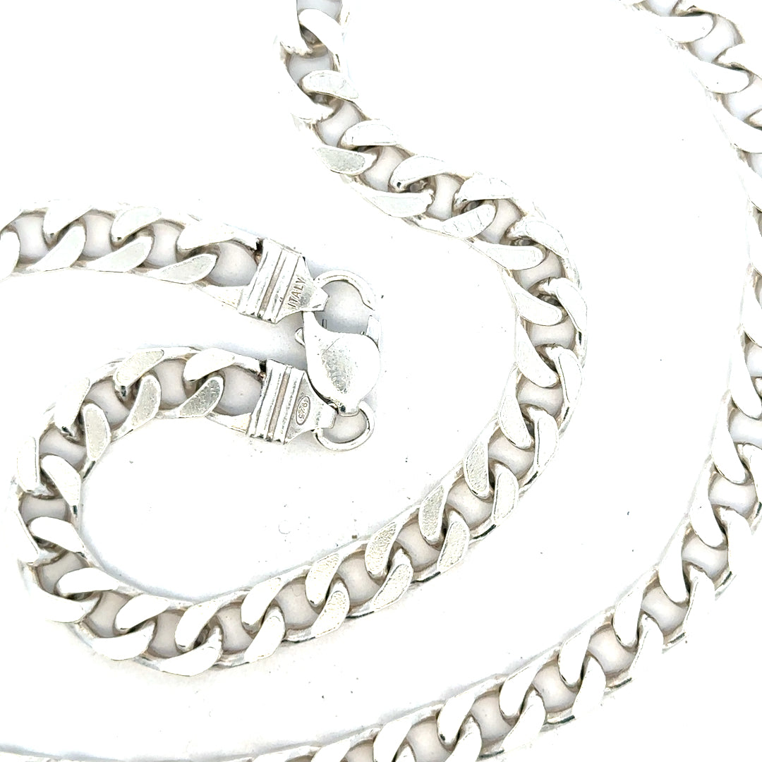 Silver curb chain weighing 63.4g, featuring a classic design with interlocking links, perfect for jewelry accessories.