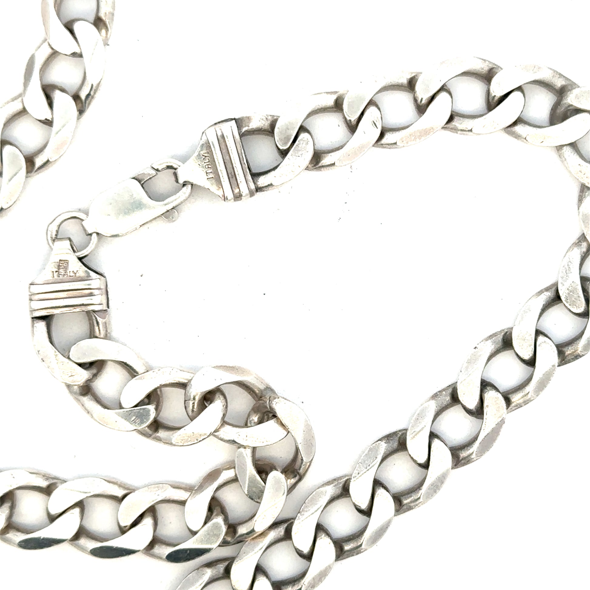 Silver curb chain jewelry, 80.2g, with thick links, showcasing a shiny finish and sturdy design.