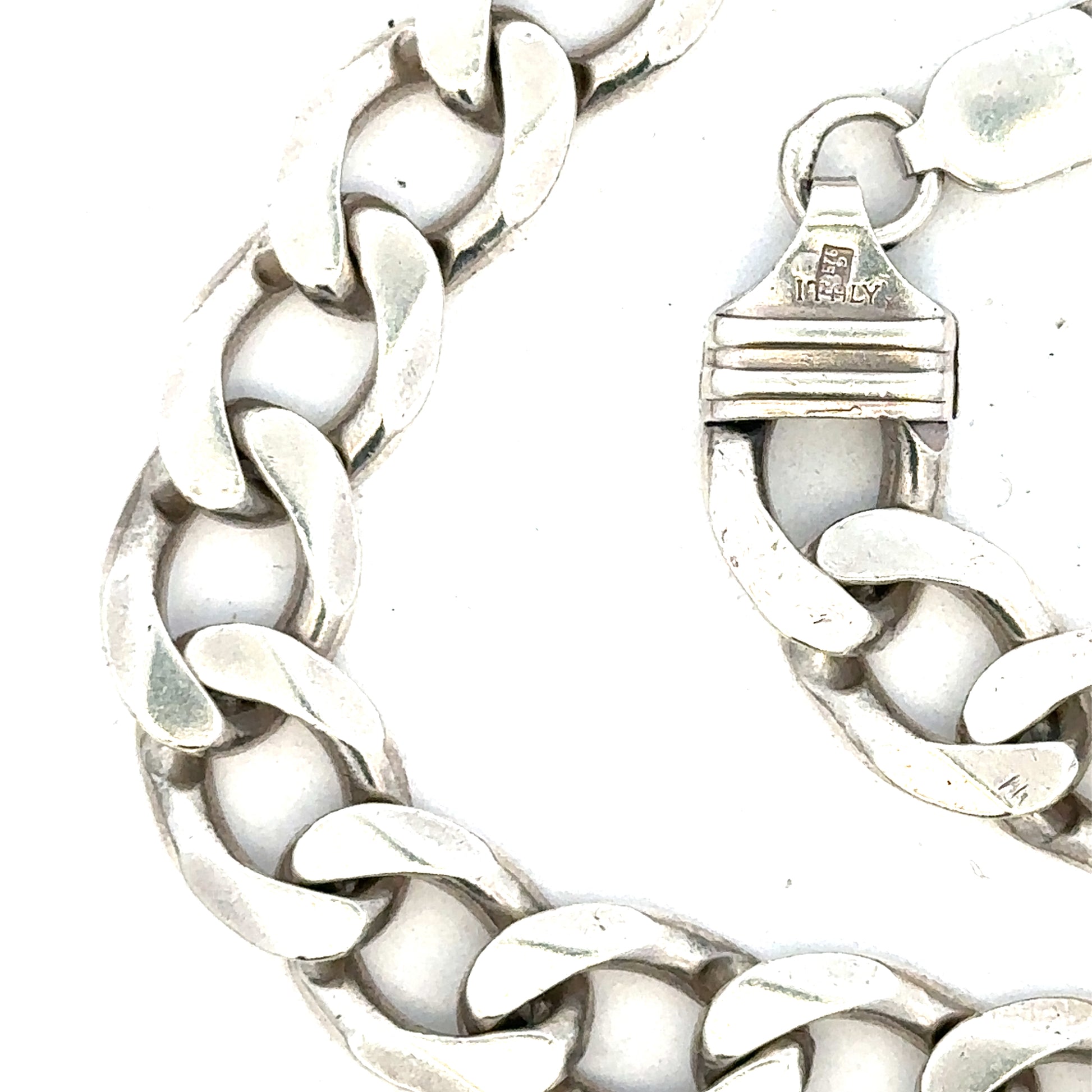 Silver curb chain weighing 80.2g, featuring classic interlocking links, ideal for jewelry or accessories.