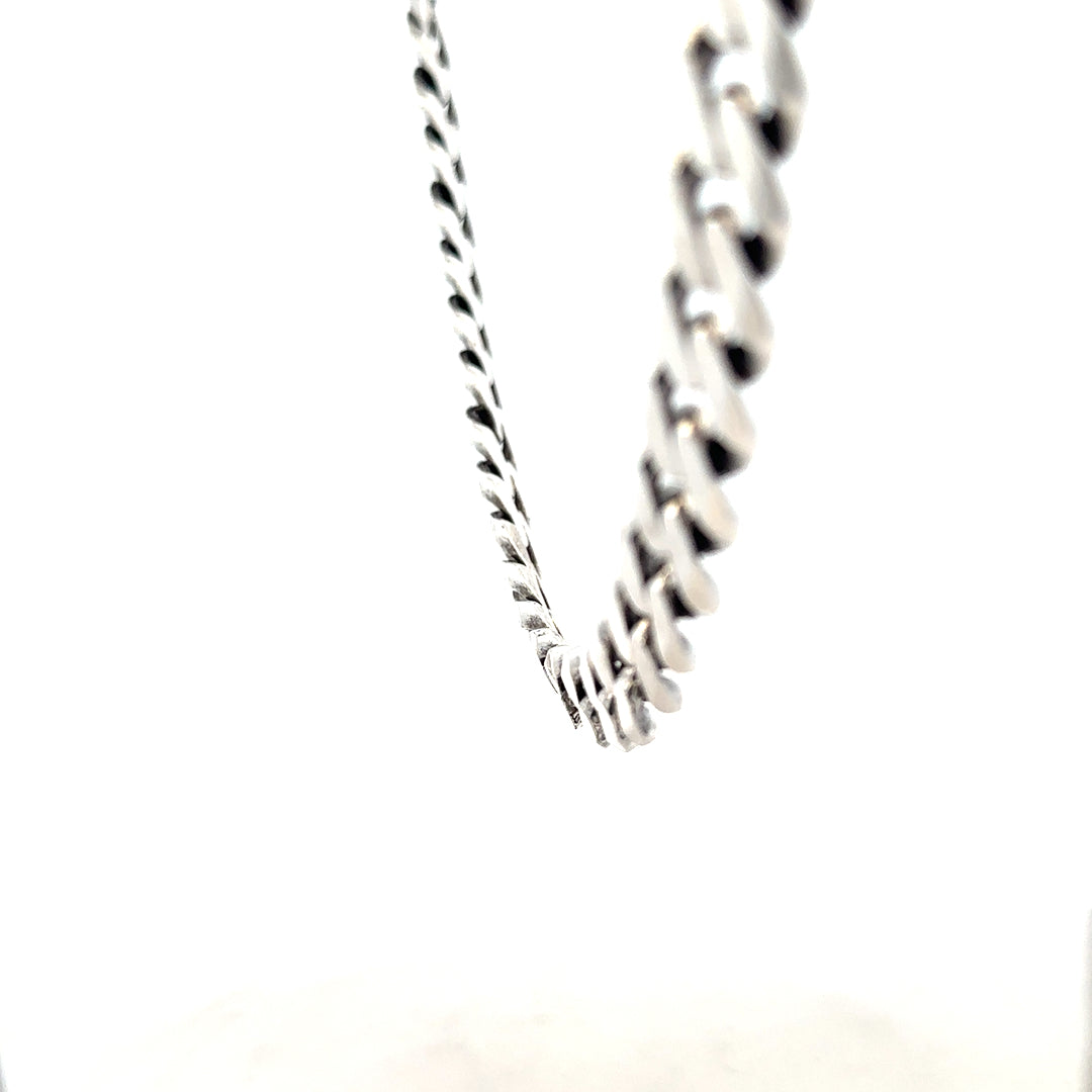 Silver curb chain necklace weighing 91.1g, featuring interlinked flat oval links, crafted with a sleek, polished finish.