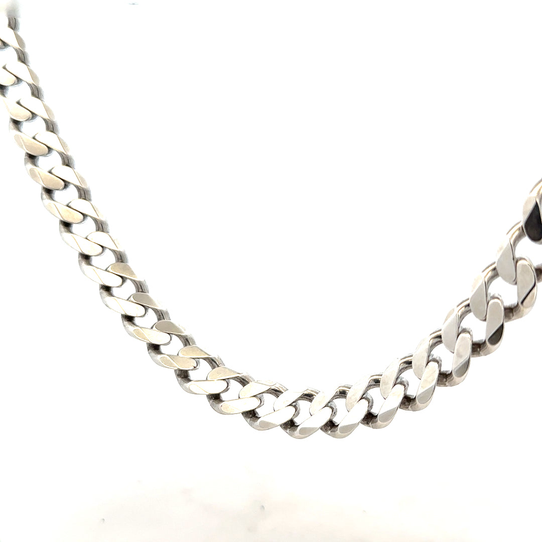 Silver curb chain necklace weighing 94.7g, featuring a classic design and polished finish, displayed on a neutral background.
