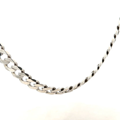 Silver curb chain necklace weighing 94.7g, featuring a classic design with interlocking links, unbranded jewelry accessory.