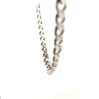 Silver curb chain weighing 96.3g, featuring a classic design with interconnected links, ideal for jewelry or accessories.