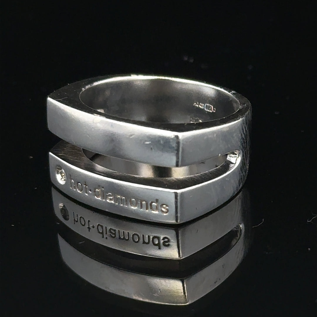 Silver hot diamond ring in size R1/2 featuring sparkling diamonds, crafted with a sleek band design.