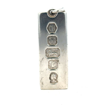 Silver ingot pendant, 31g, unbranded, featuring a smooth, polished silver ingot design for jewelry or display.