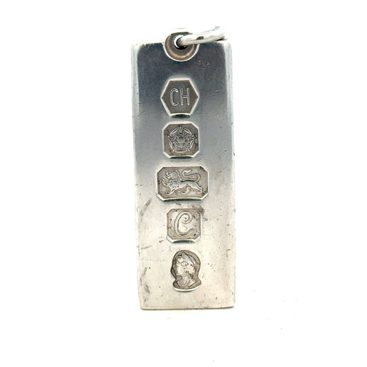 Silver ingot pendant, 31g, unbranded, featuring a smooth, polished silver ingot design for jewelry or display.