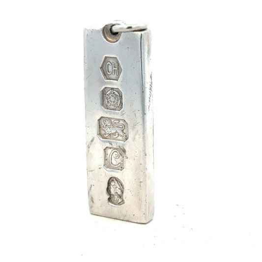 Silver ingot pendant weighing 31g with a sleek, polished finish, featuring a simple rectangular shape and unbranded design.