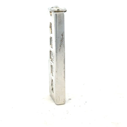 Silver ingot pendant weighing 31g, unbranded jewelry piece with a smooth, polished surface and rectangular shape.