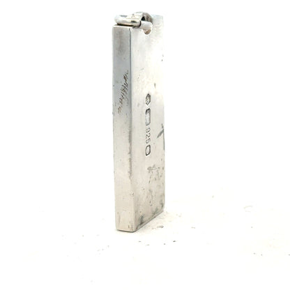 Silver ingot pendant, 31g, unbranded, detailed close-up showing polished silver surface and pendant shape.