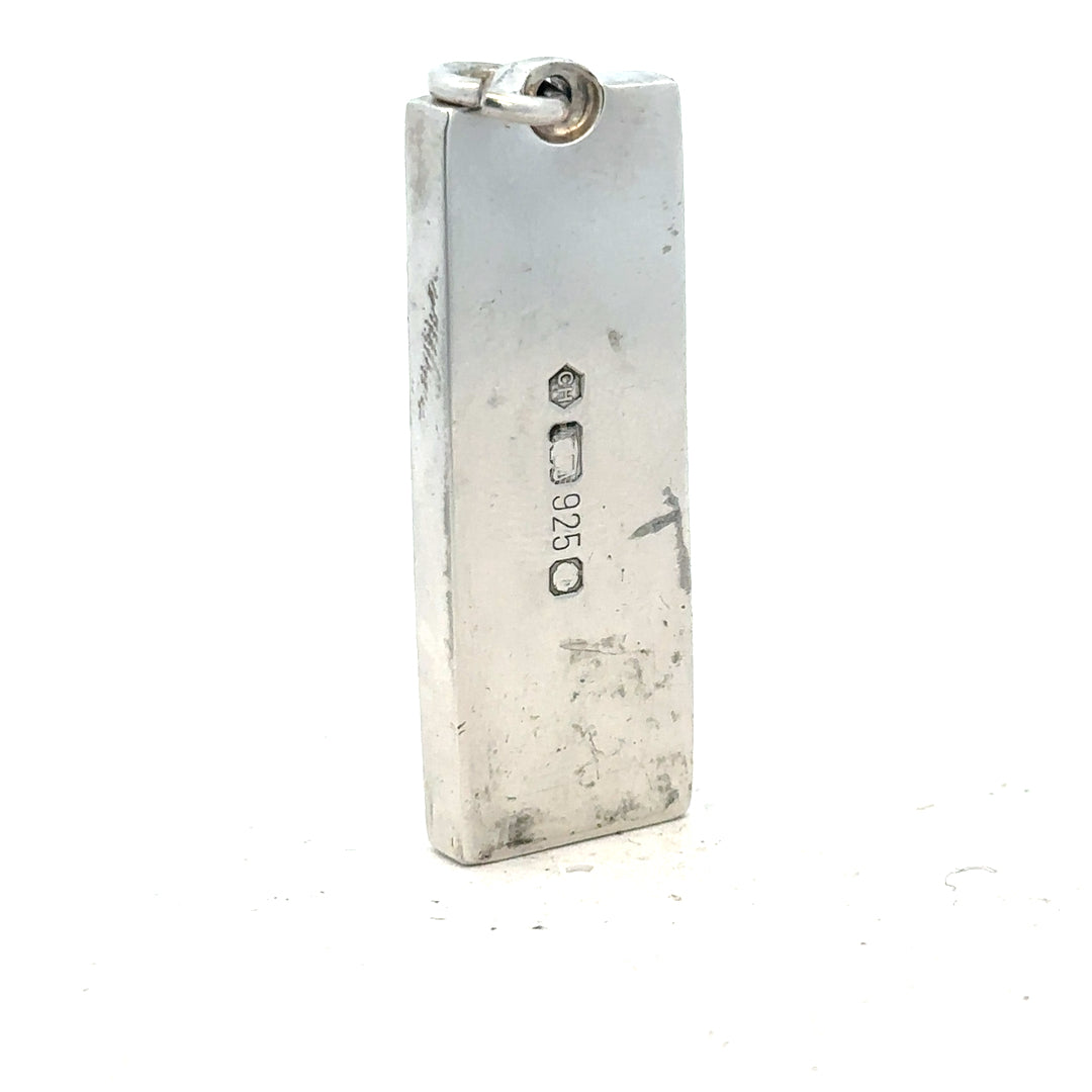 Silver ingot pendant weighing 31g, unbranded jewelry piece with a sleek, polished silver design for necklace adornment.