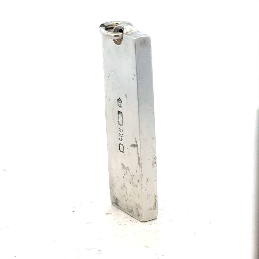 Silver ingot pendant weighing 31g, unbranded, with a sleek rectangular design and polished finish.